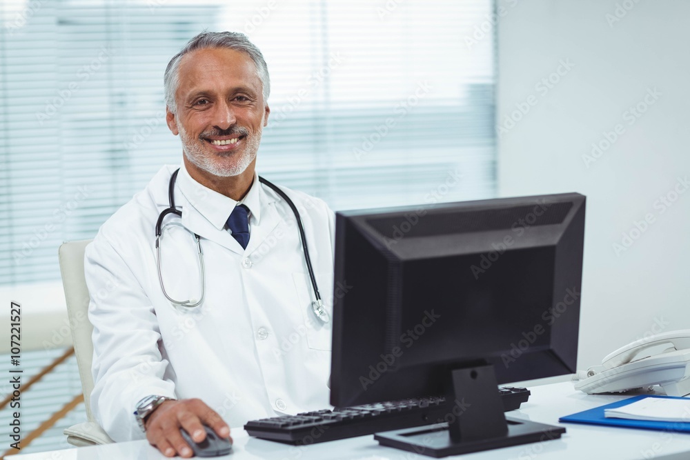 Doctor working on his computer Doctor working on his computer