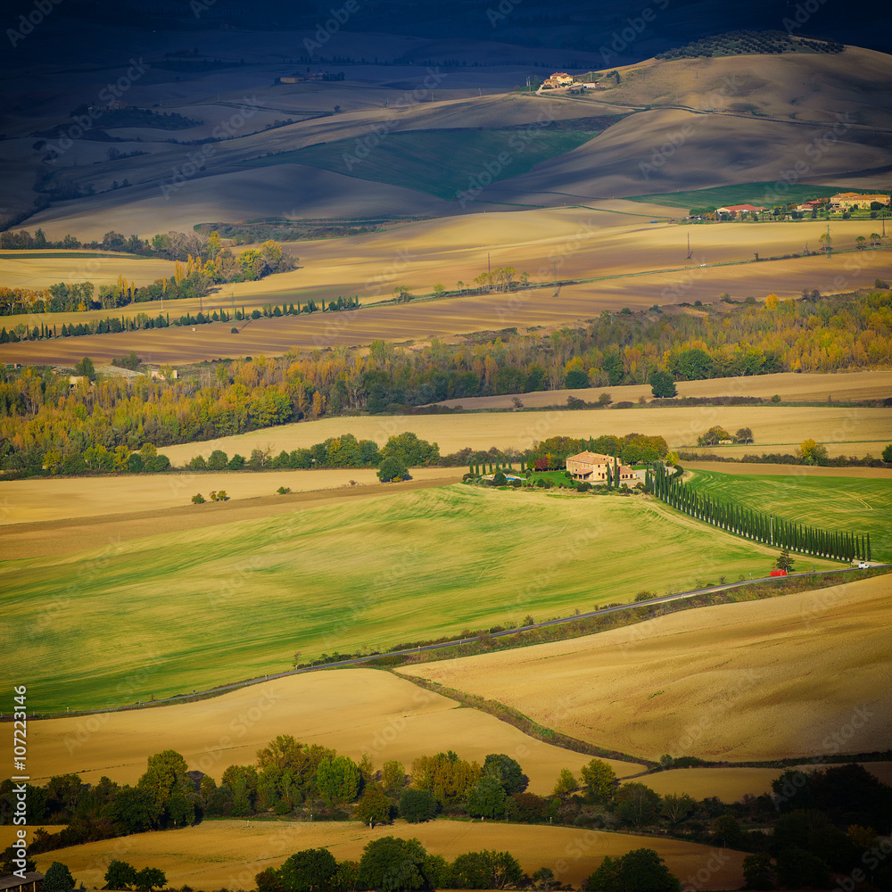Wavy fields in Tuscany at sunset, Italy. Natural outdoor seasonal spring background.