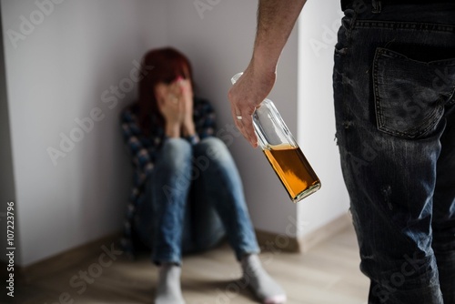Woman abused by drunken husband.