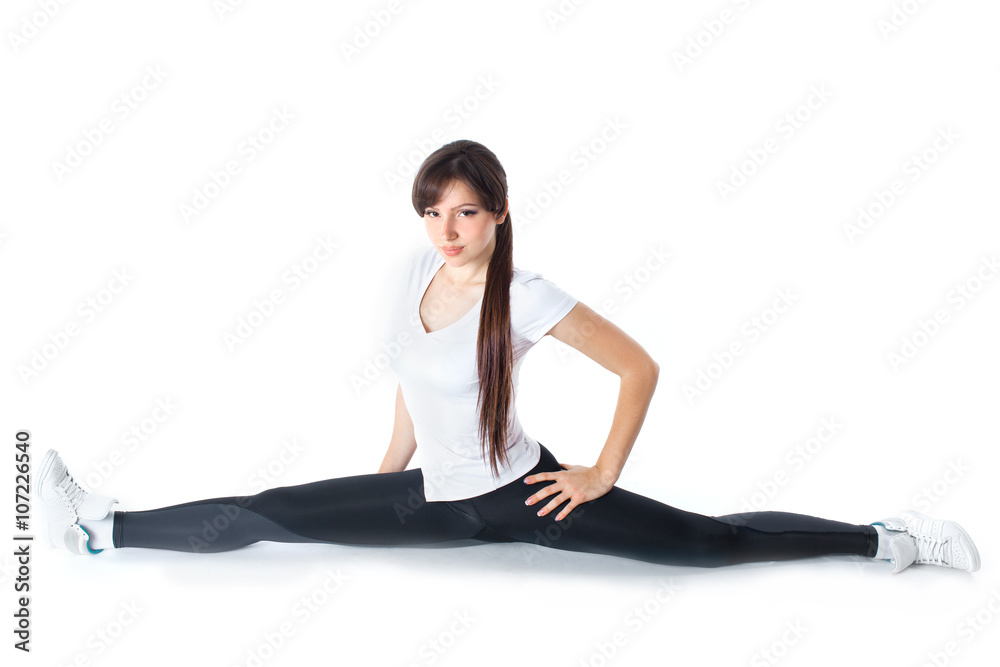 Young attractive female fitness woman performing a twine Young attractive female fitness woman performing a twine