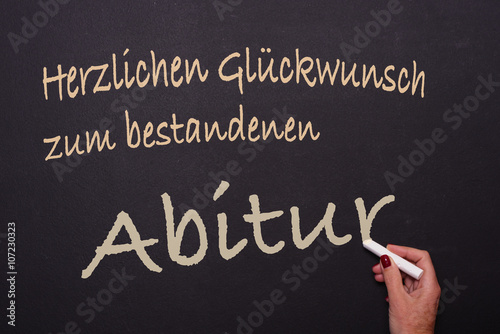 Billede på lærred Lehrerin schreibt an die Tafel: Herzlichen Glückwunsch zum best