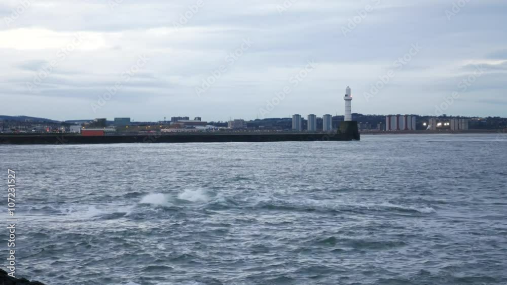Lighthouse and wave at Aberdeen coast Scotland
Lighthouse and wave at Aberdeen coast Scotland