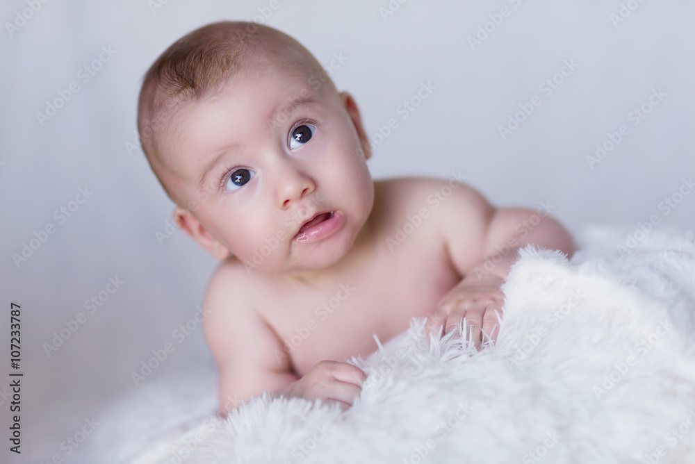 Naked Newborn Baby Lying on Blanket and Looking Up, Curiousl Naked Newborn Baby Lying on Blanket and Looking Up, Curiousl