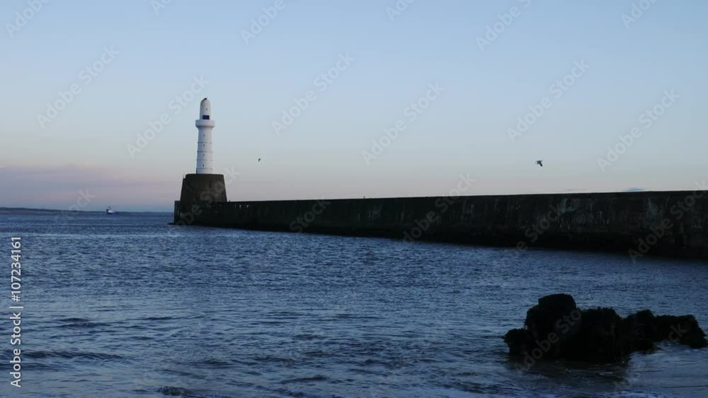 Lighthouse and wave at Aberdeen coast Scotland
Lighthouse and wave at Aberdeen coast Scotland