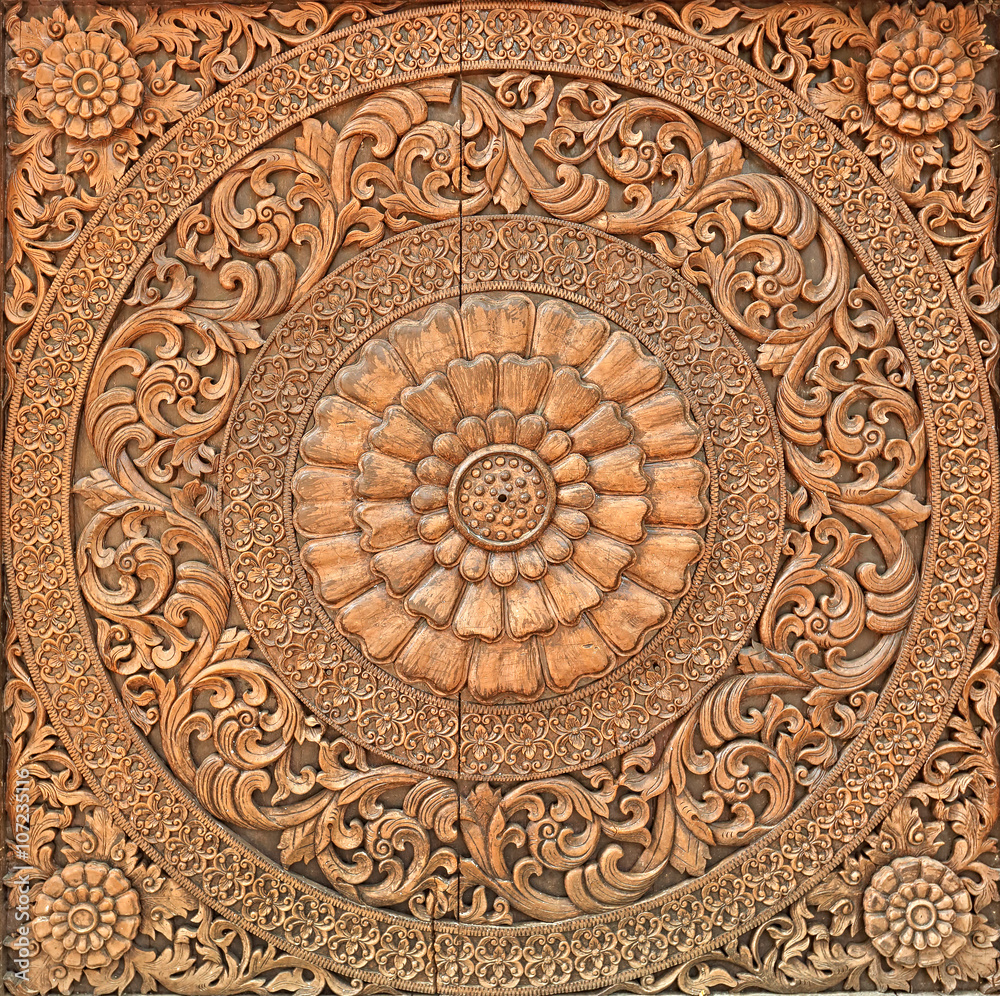 Pattern of flower carved on wood background