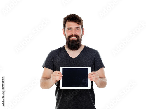 Young man with long beard and a tablet