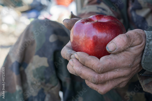 dirty hands and fresh apple