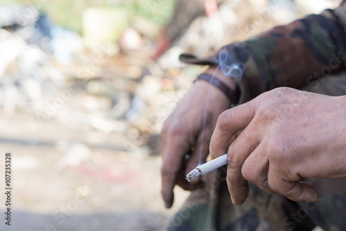 hand holding cigarette