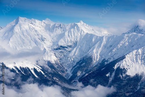 top view to Caucasian mountains peaks covered by snow  © Pavel Burchenko