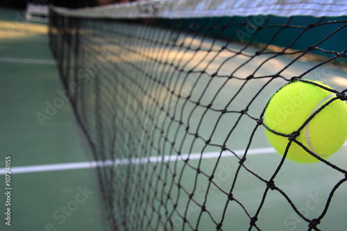 Tennis ball in net © phaitoon