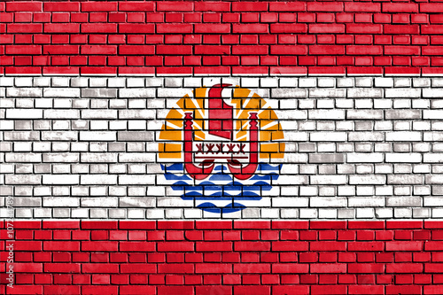 flag of French Polynesia painted on brick wall