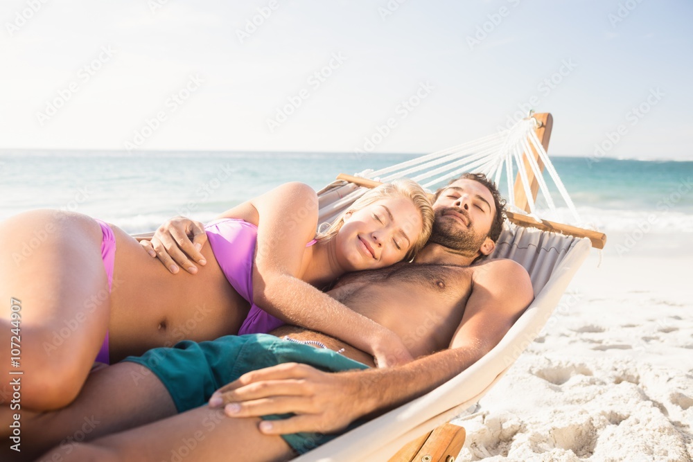 Fototapeta premium Couple lying in hammock