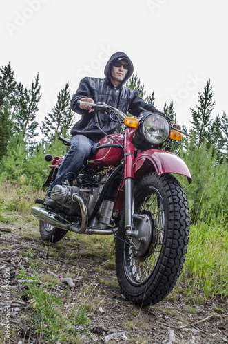 Fototapeta Naklejka Na Ścianę i Meble -  Coolest biker in the woods