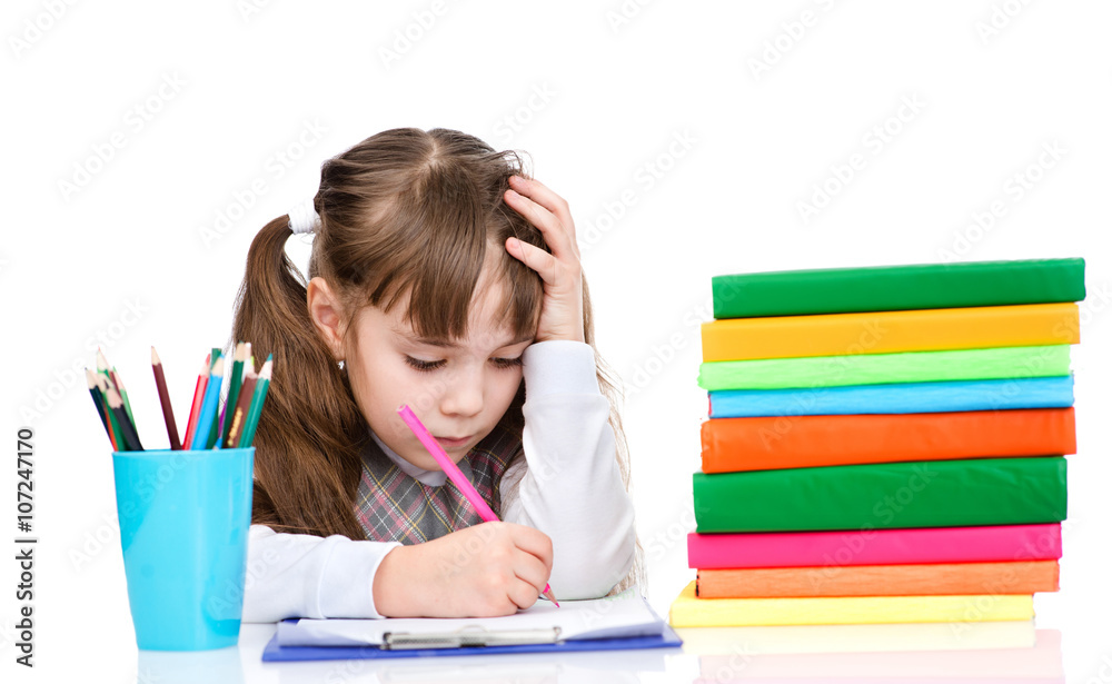 Schoolgirl write test. isolated on white background Schoolgirl write test. isolated on white background