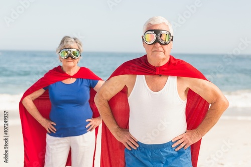 Senior couple wearing superman costume photo