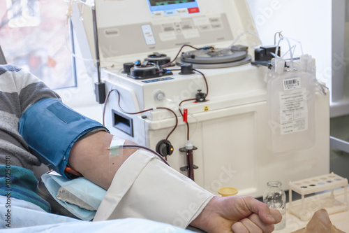 The process of sampling from the donor plasma. Insert the needle into the elbow bend
