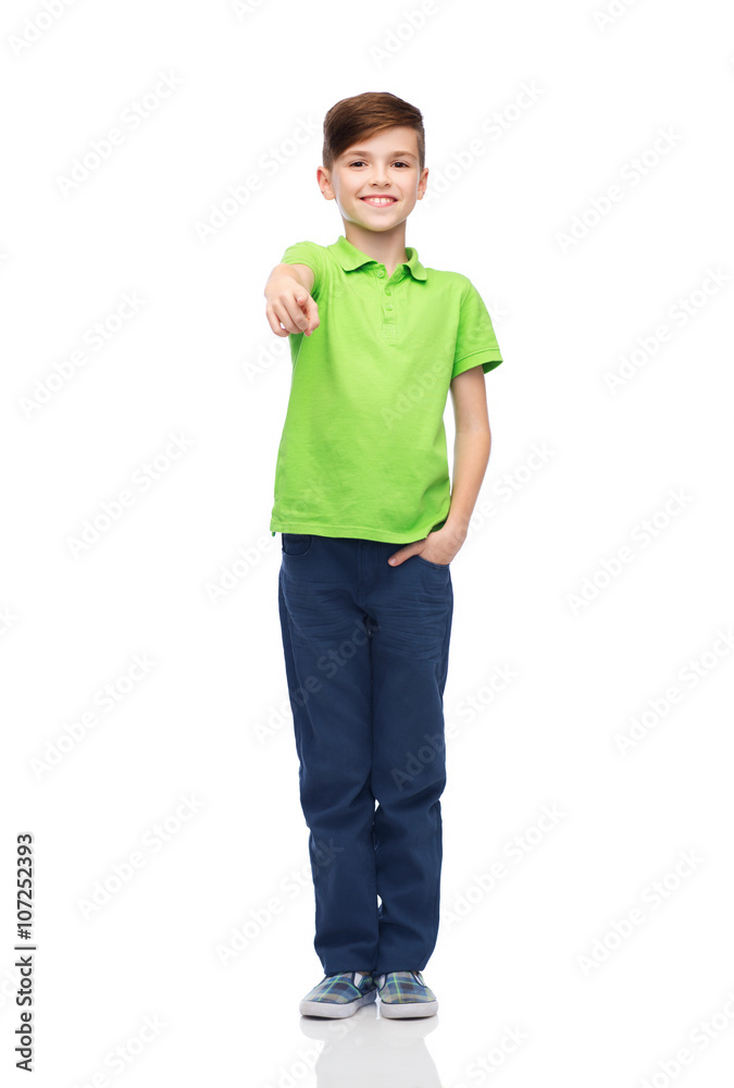 happy boy in white t-shirt pointing finger to you happy boy in white t-shirt pointing finger to you