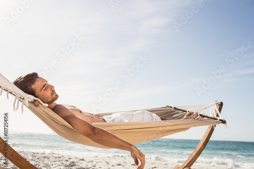 Man sleeping in hammock photo