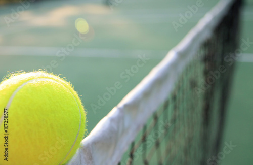 Tennis ball on net © phaitoon