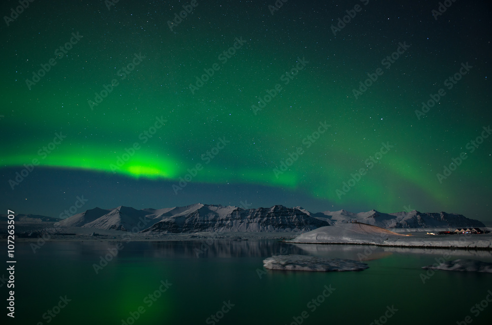 Aurora Borealis or Northern Lights over the glacier lagoon Jokulsarlon, Iceland