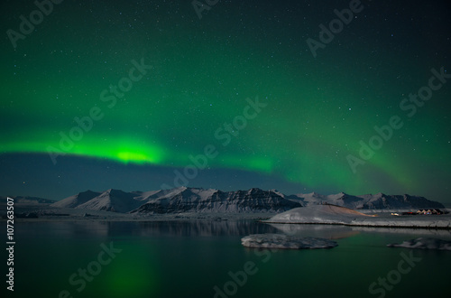 Aurora Borealis or Northern Lights over the glacier lagoon Jokulsarlon, Iceland © dash1502