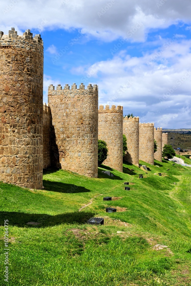 Mighty medieval wall and towers surrounding the old town of Avila, Spain