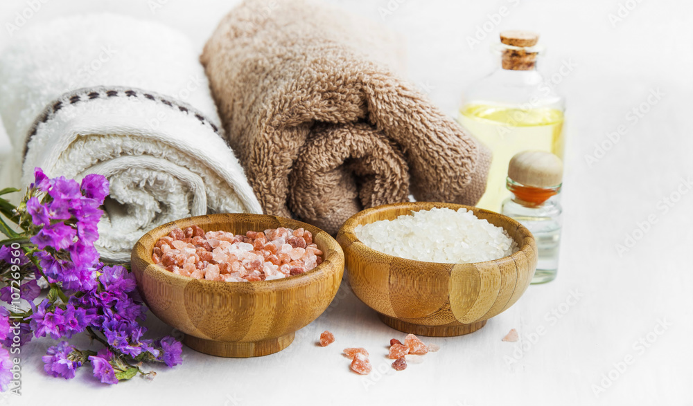 Spa still life with towels,purple towels, salt and bath oil Spa still life with towels,purple towels, salt and bath oil