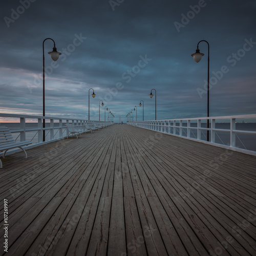 Beautiful landscape with wooden pier in Gdynia Orlowo at sunrise. © R_Szatkowski