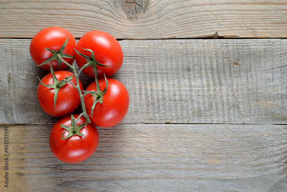 Tomatoes on wooden table top view Tomatoes on wooden table top view