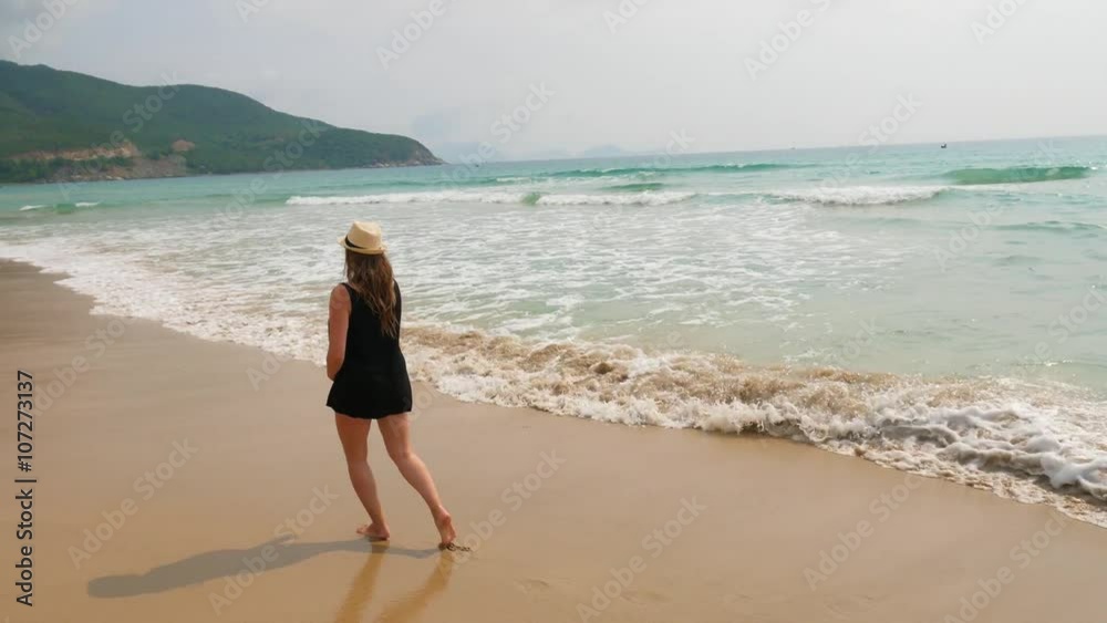 Expectant mother on the beach. Pregnant woman walking along the seashore Expectant mother on the beach. Pregnant woman walking along the seashore