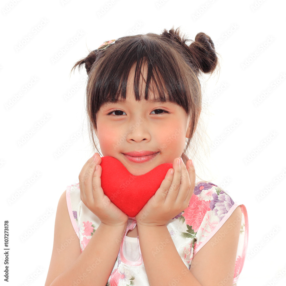 Adorable Chinese little girl holding red heart Adorable Chinese little girl holding red heart