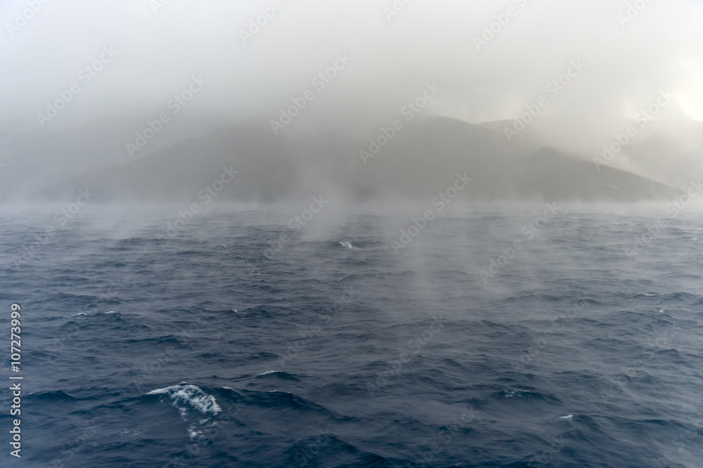 Obraz premium Wild sea during winter. Dramatic scenery with dark clouds and he