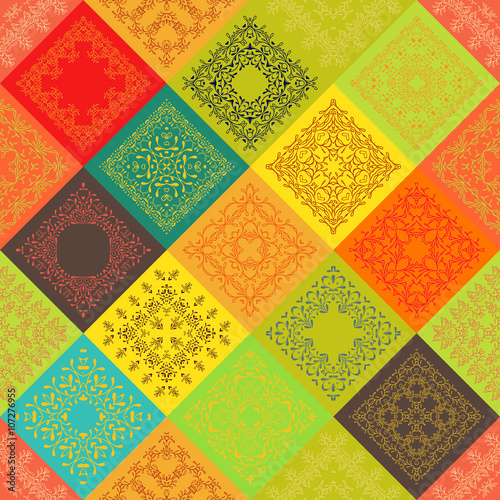 Seamless abstract colorful vintage ceramic tiles with Moroccan pattern frame of trendy flower ornament. Background textures. For fabric textile swatch. India Islam mexican ethnic. Orange, red yellow 