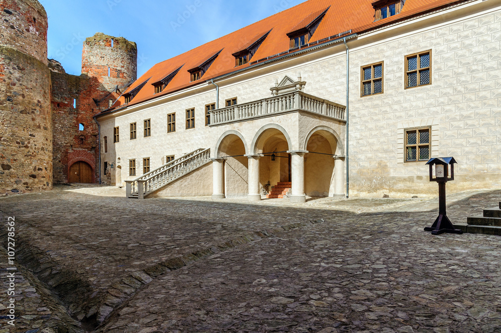 Courtyard with beautiful stairs of medieval castle in Cesis town, Latvia