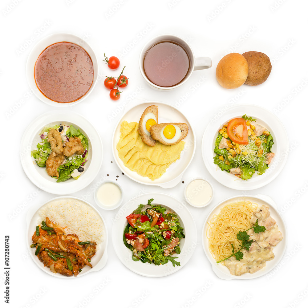 Top view of many plates with food Top view of many plates with food