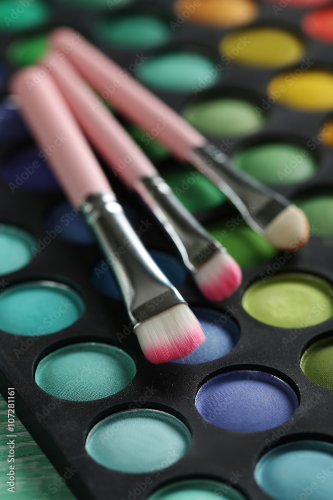 Makeup brush set with palette, close up Makeup brush set with palette, close up