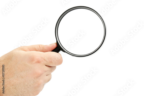 Male hand holding magnifying glass on a white background