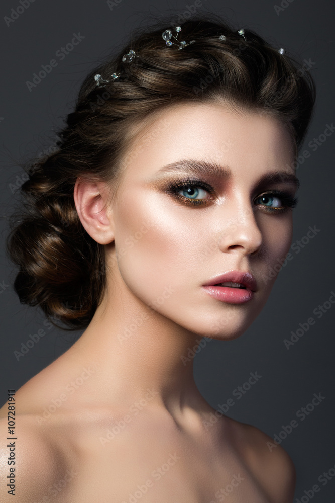 Portrait of young beautiful woman with bridal makeup and coiffur Portrait of young beautiful woman with bridal makeup and coiffur