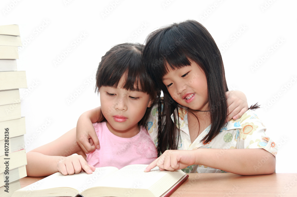 Intelligent little girl reading a book Intelligent little girl reading a book