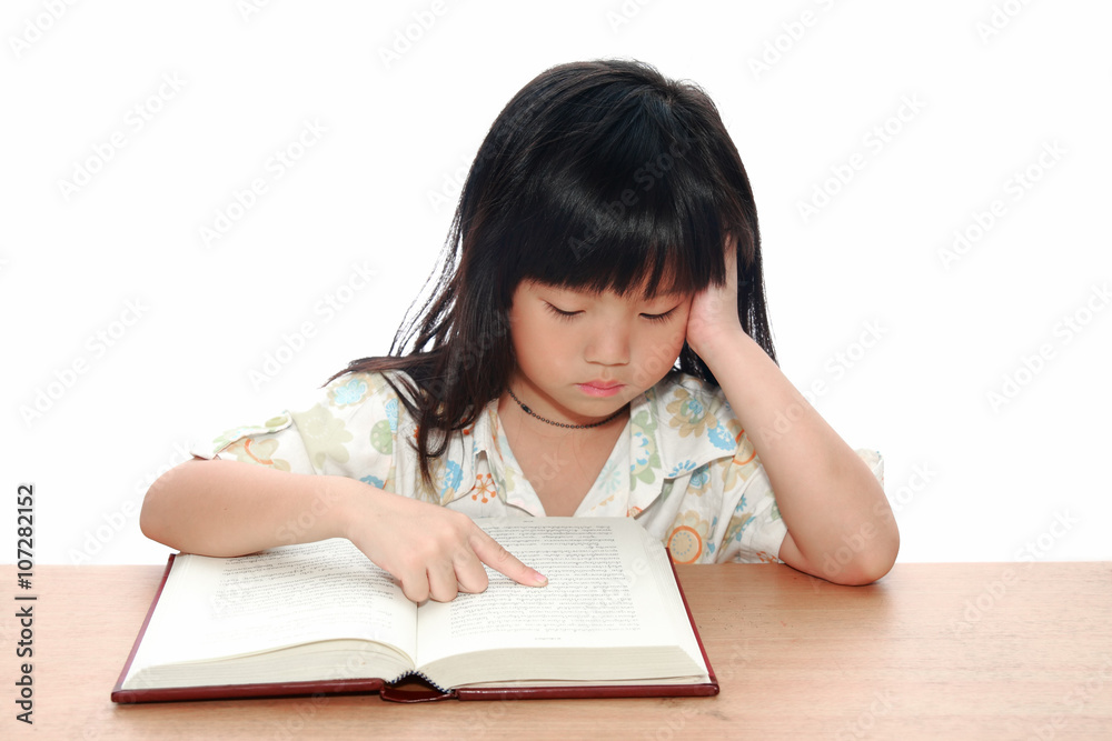 Intelligent little girl reading a book Intelligent little girl reading a book