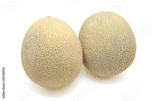 Cantaloupe melon slices isolated on white background