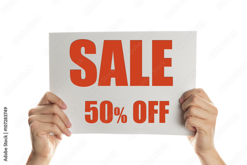 Hand holding a banner with the words sale 50 percent off