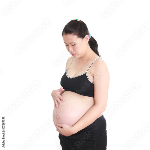 pregnant woman caressing her belly on white background