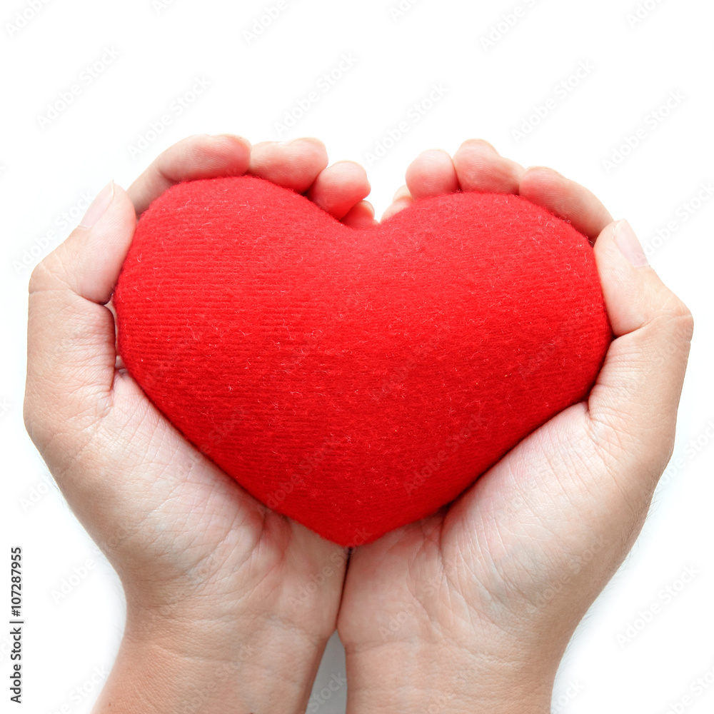 Red heart symbol on hands Red heart symbol on hands