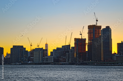 Photography Tower cranes over a Manhattan.