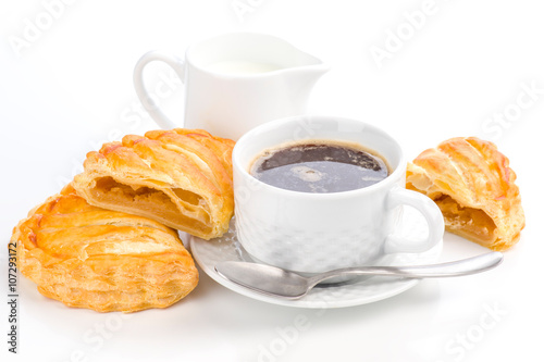 cup of coffee and milk with fresh stuffed pasta photo