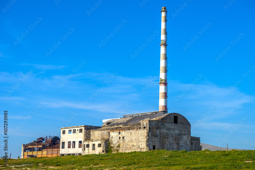 Old factory building in Piraeus, Athens. Clear blue sky in the b