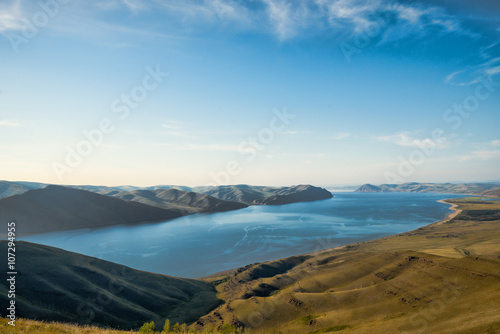Beautiful landscape with hills and wide river 