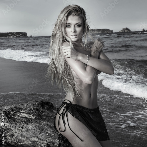 Sexy blonde girl on the beach.
