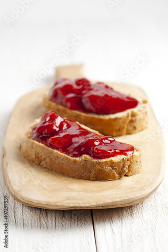 two slices of strawberry jam sandwich